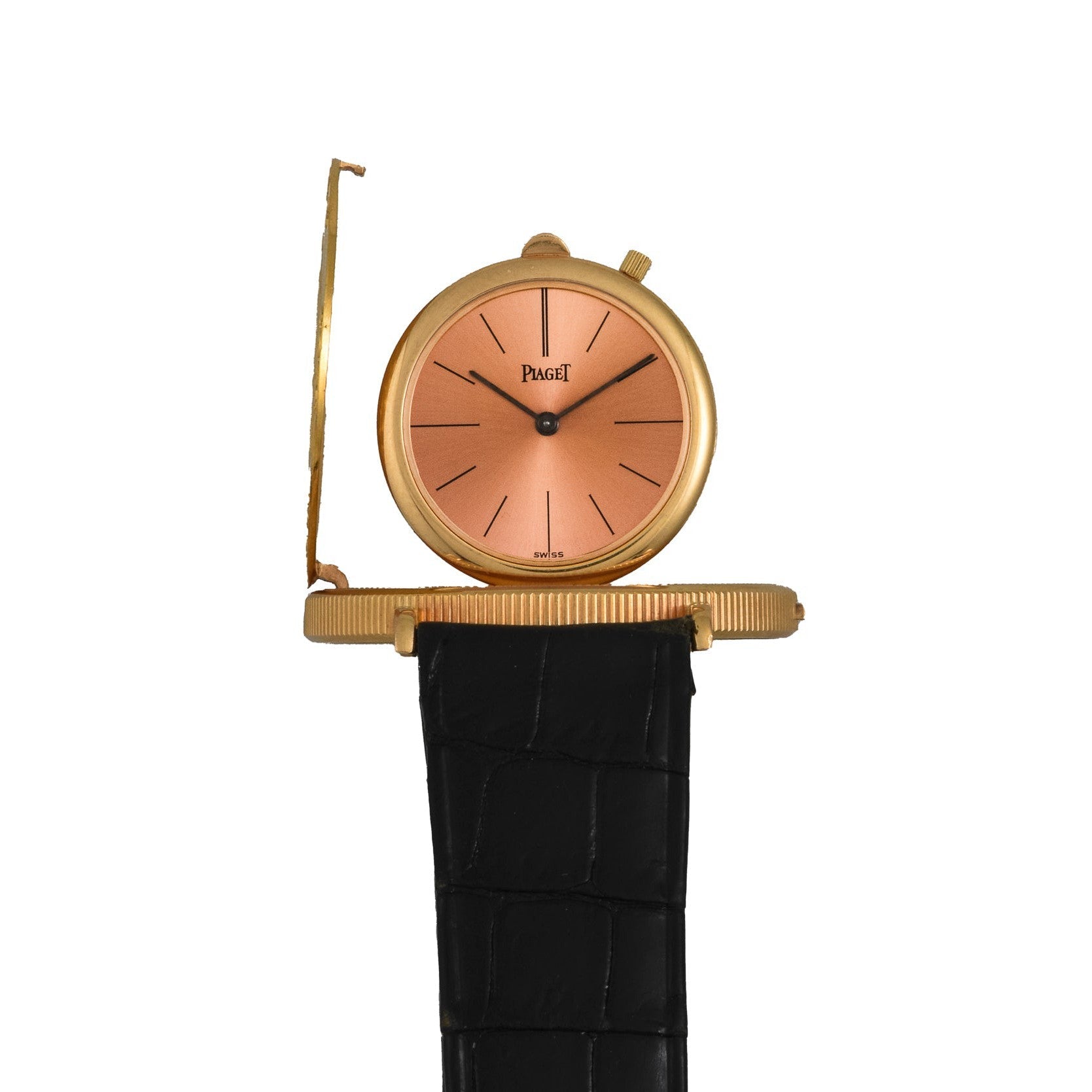The Piaget 1877 Twenty Dollar Coin Watch features a peach dial, black leather strap, and a partially open hinged cover.