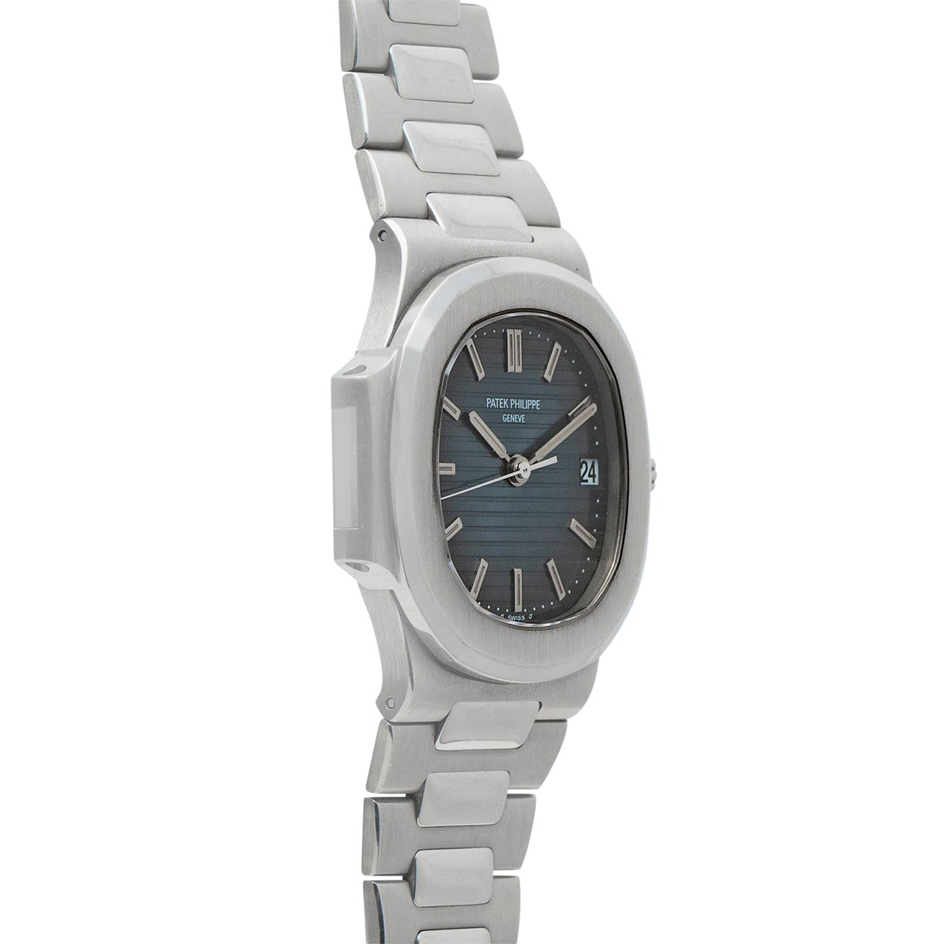 The Patek Philippe Nautilus, a silver metal wristwatch with a blue dial, date display, and linked bracelet, is shown at an angle.