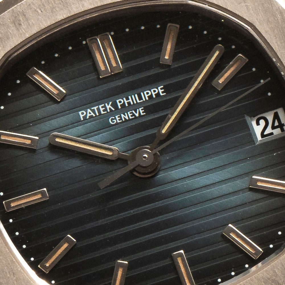 Close-up of a Patek Philippe Nautilus watch face displaying the time 10:09 and the date 24.
