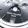 Close-up of the Patek Philippe Annual Calendar Moonphase watch face, featuring the moonphase indicator, brand logo, and date display.