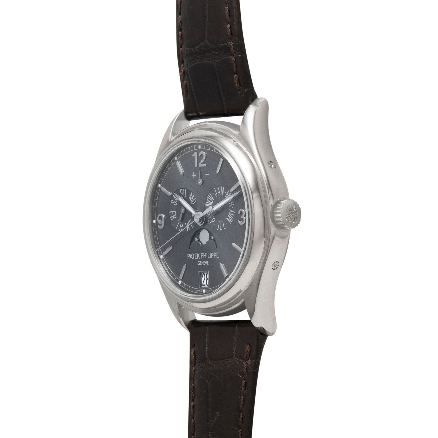 Patek Philippe Annual Calendar Moonphase wristwatch featuring a black dial and brown leather strap, displayed at an angle.