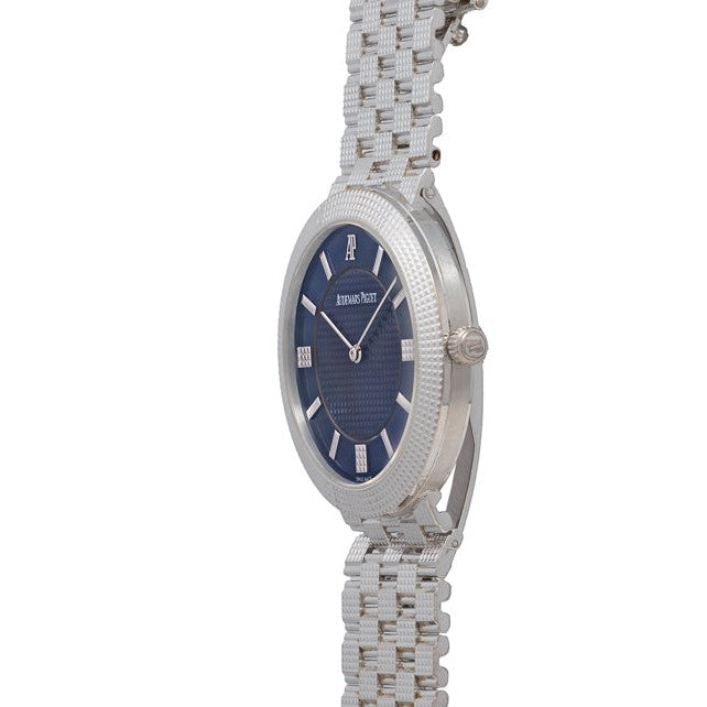 Audemars Piguet Classic White Gold Ultra-Thin wristwatch with a blue dial and white gold bracelet, displayed from a side angle on a white background.