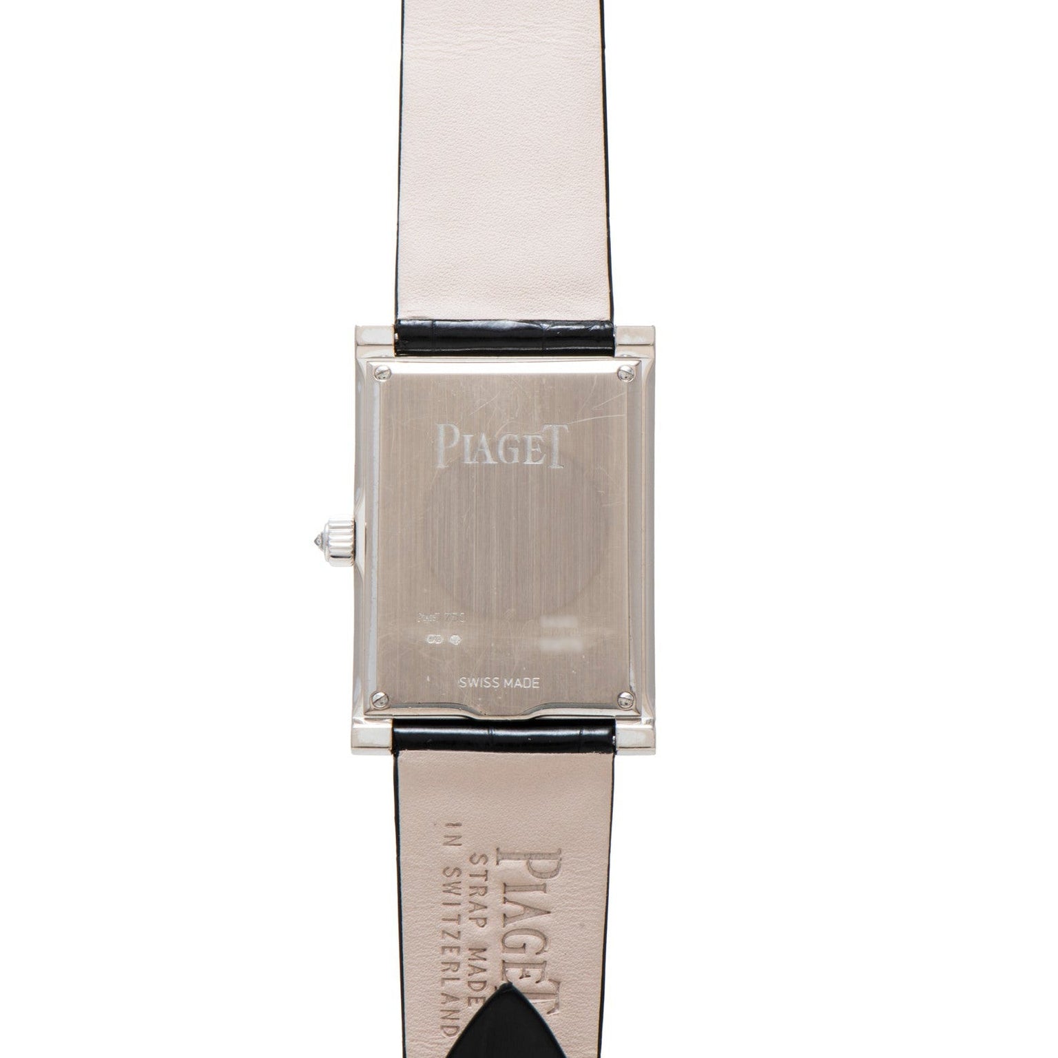 Rectangular Piaget Limelight Baguette Diamond Dress Watch with a cream leather strap, shown from the back.