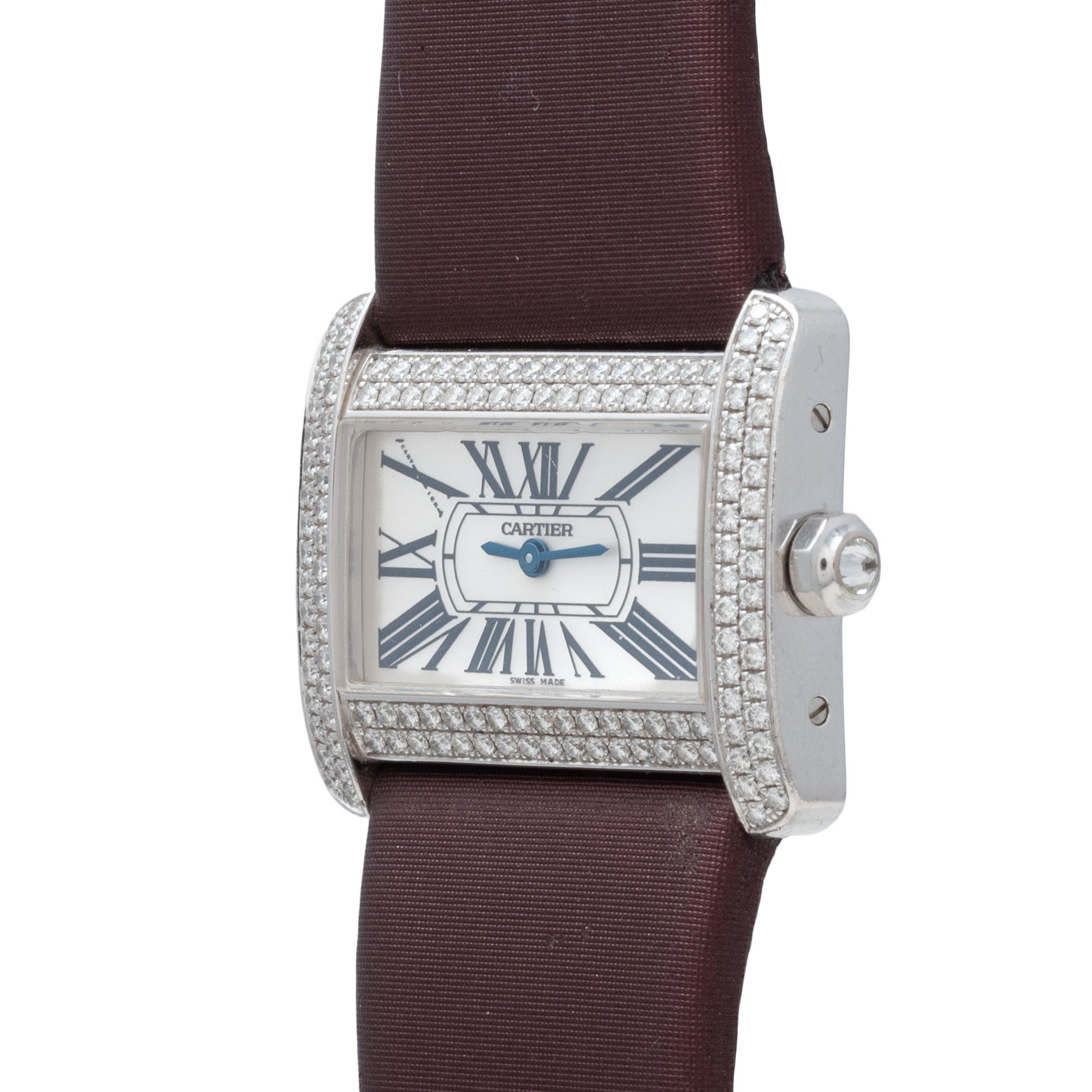 Cartier Tank Divan watch featuring a diamond bezel, Roman numerals, and brown strap, shown from an angled view.