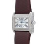 Cartier Tank Divan watch featuring a diamond bezel, Roman numerals, and brown strap, shown from an angled view.