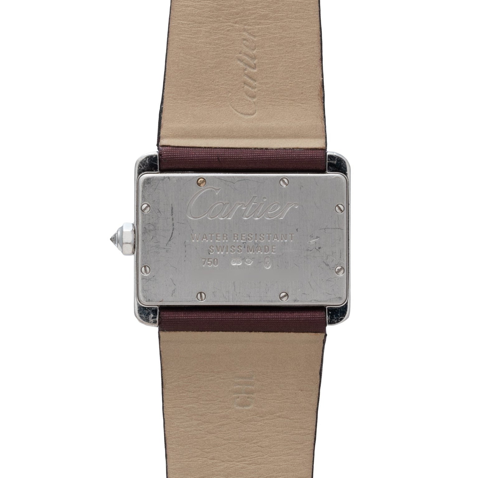 Back of a Cartier Tank Divan watch with leather strap, featuring engraved brand name and product details.