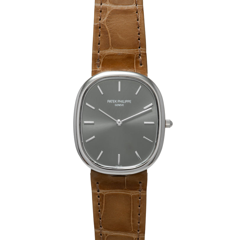 The Patek Philippe Ellipse wristwatch features a brown leather strap and a silver-toned dial.