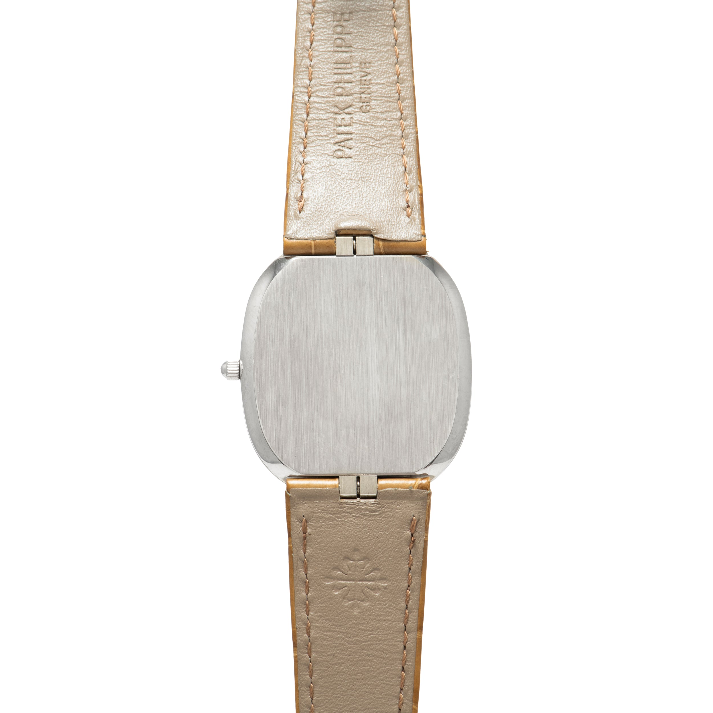 The Ellipse by Patek Philippe features a silver square watch case and a beige leather strap, displayed from the back.