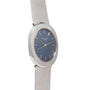 The Patek Philippe Dress Watch UFO features a blue face, silver case, and textured metal band, displayed at an angle.
