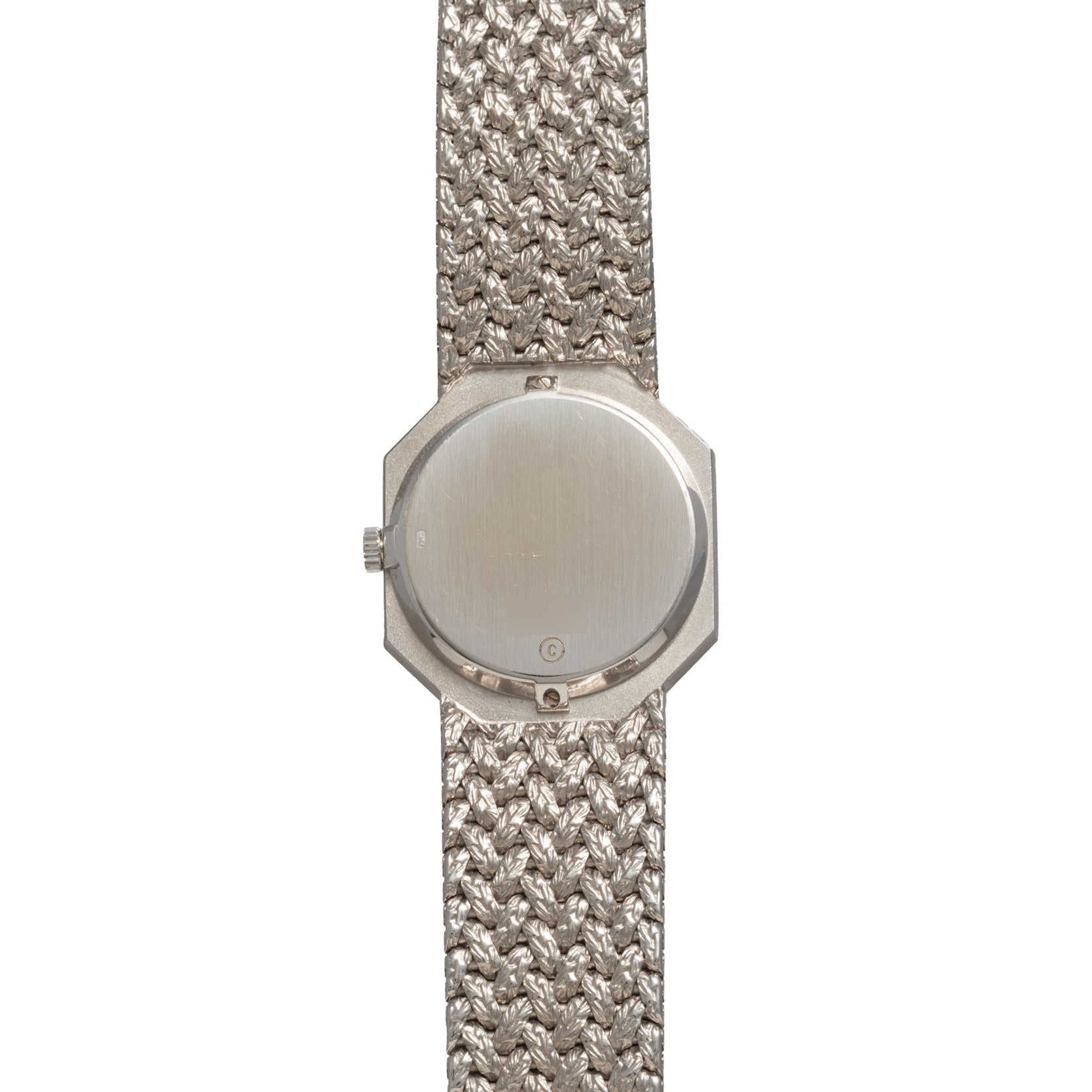 The Piaget Lapis Lazuli White Gold Dress Watch features a textured metal band in silver, displayed from the back with the watch face not visible.