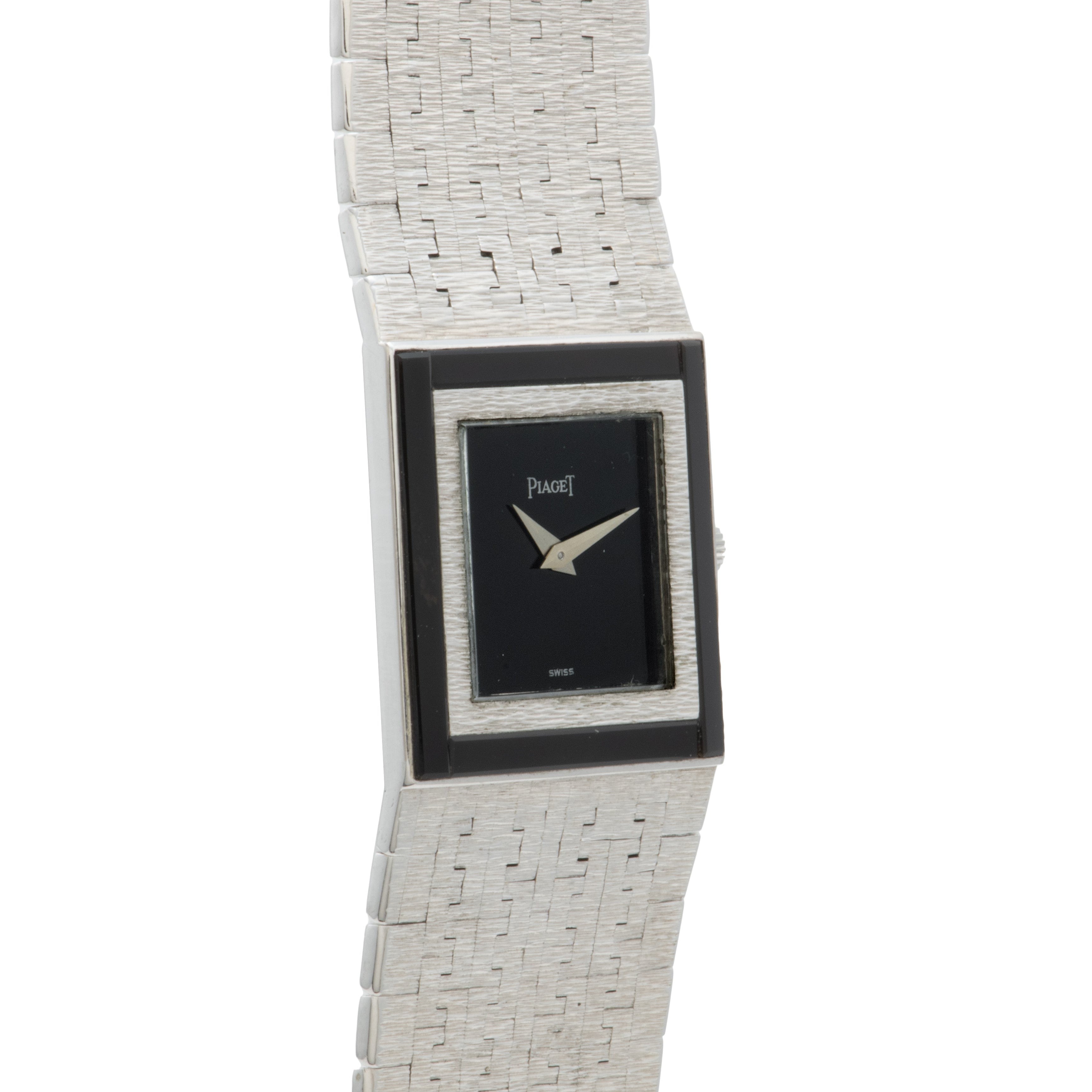 A Piaget white gold Onyx dress watch featuring a textured band and a rectangular black watch face.