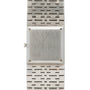 A Piaget White Gold Onyx Dress Watch with a blank face and metal link band, viewed from above.