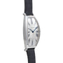 Side view of a Cartier Tonneau Platinum wristwatch featuring a silver case, white dial, blue hands, and black leather strap.