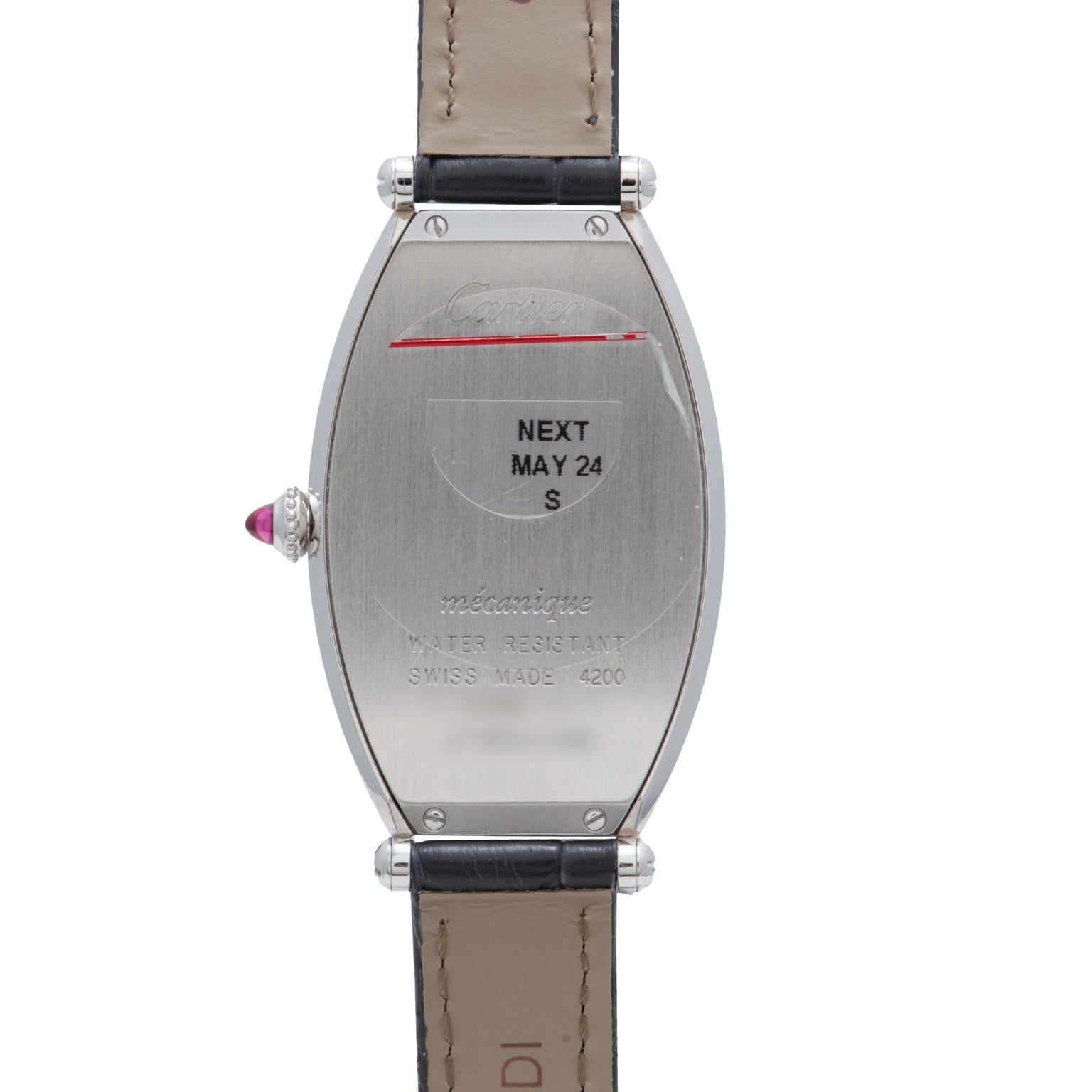The back of the Cartier Tonneau Platinum wristwatch is engraved with text, including NEXT MAY 24, and features a visible leather strap.