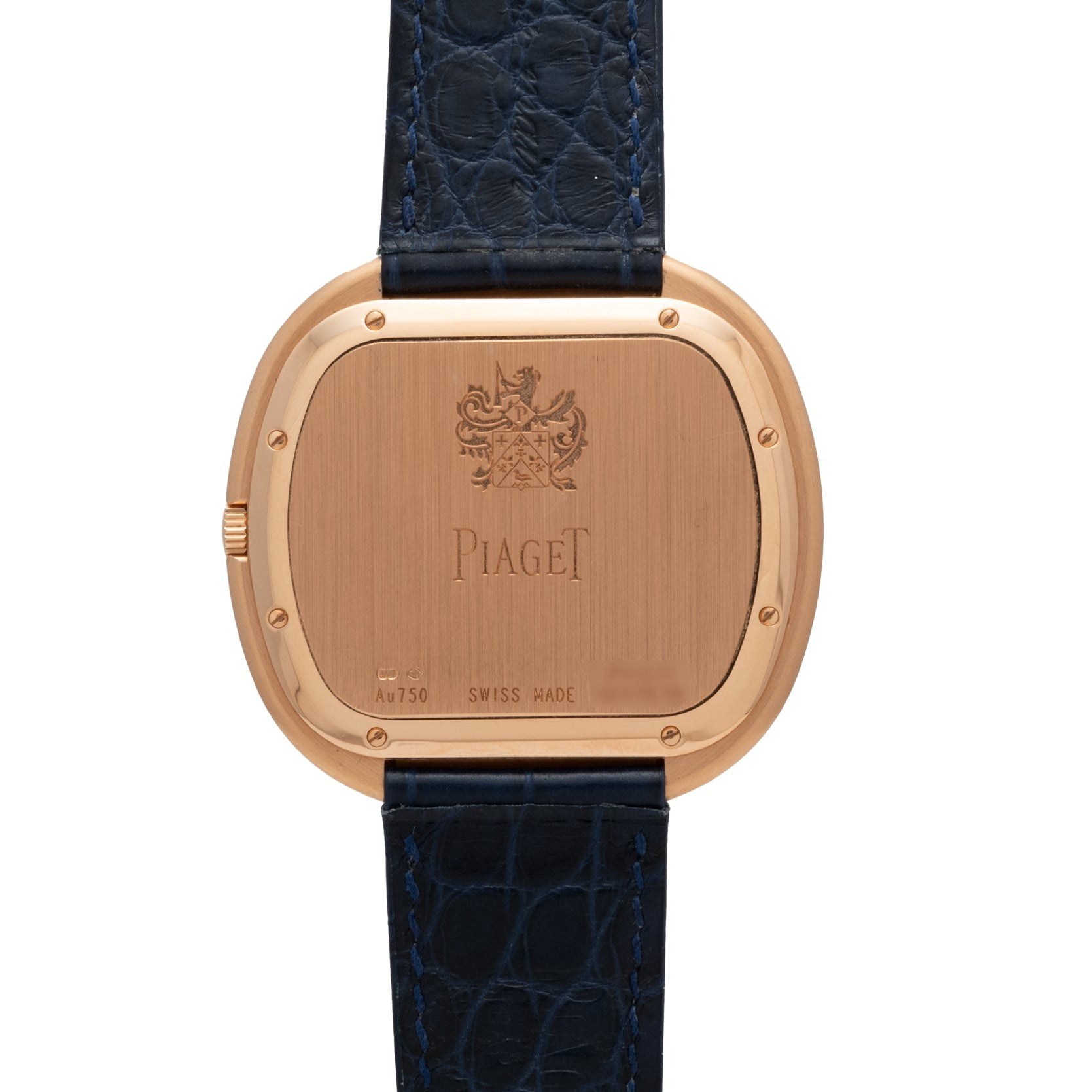 The back of a Piaget Black Tie Andy Warhol watch with a black textured leather strap and engraved markings.