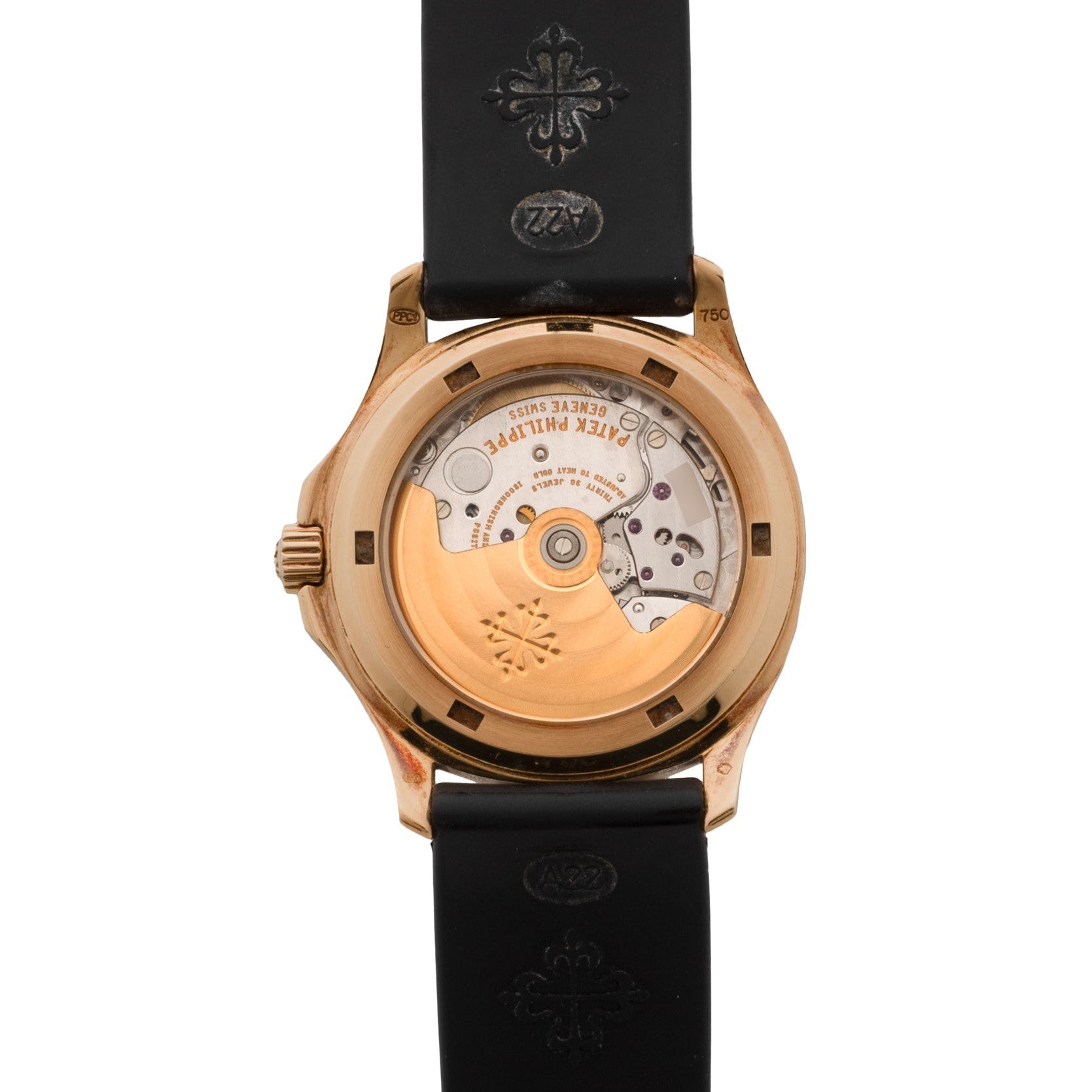 Back view of the Patek Philippe Aquanaut luxury watch featuring a visible mechanical movement and a black rubber strap.