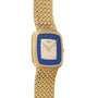 The Piaget Pave Lapis Lazuli Dress Watch features a gold textured band, blue bezel, and diamond-studded rectangular face.