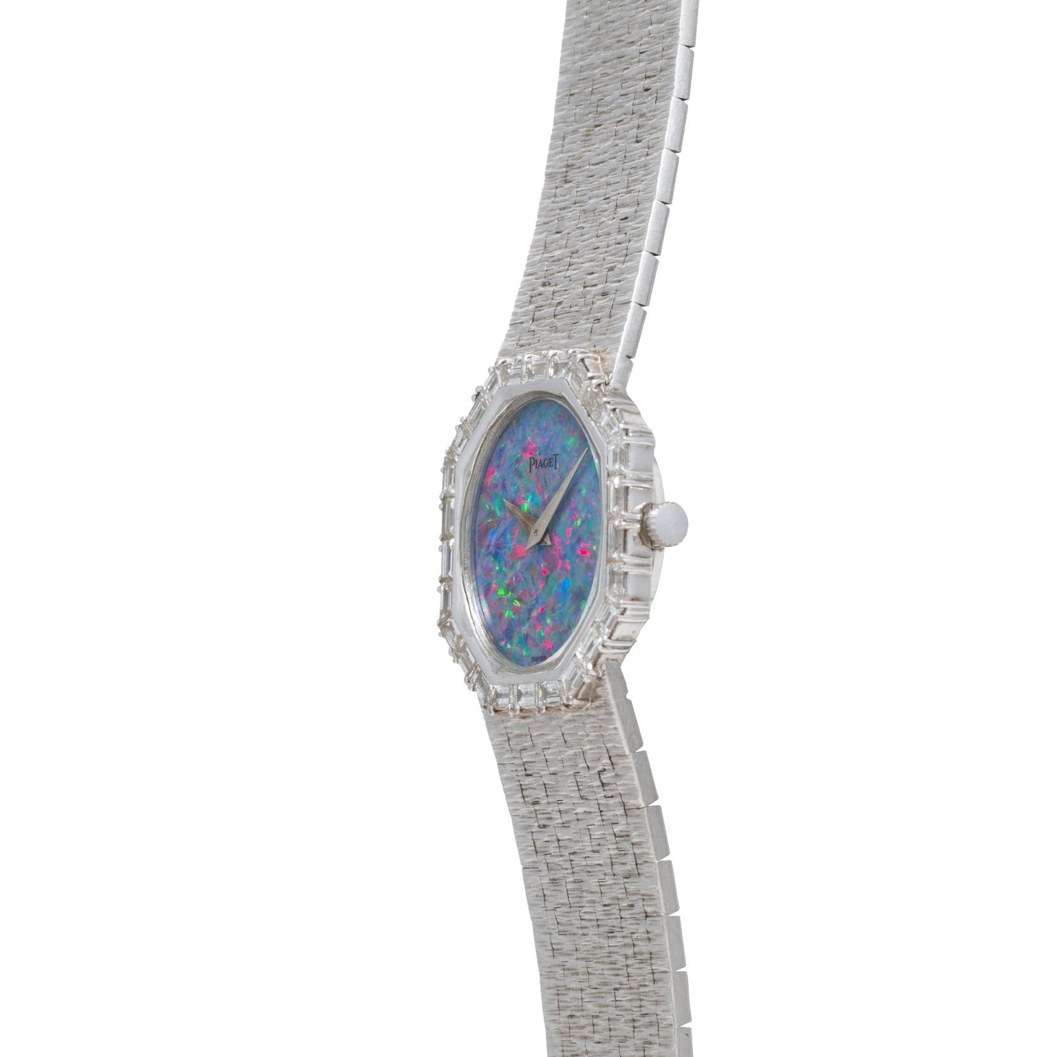 The Piaget Opal White Gold Dress Watch features a textured silver band and a vibrant opalescent face, displayed at an angle.