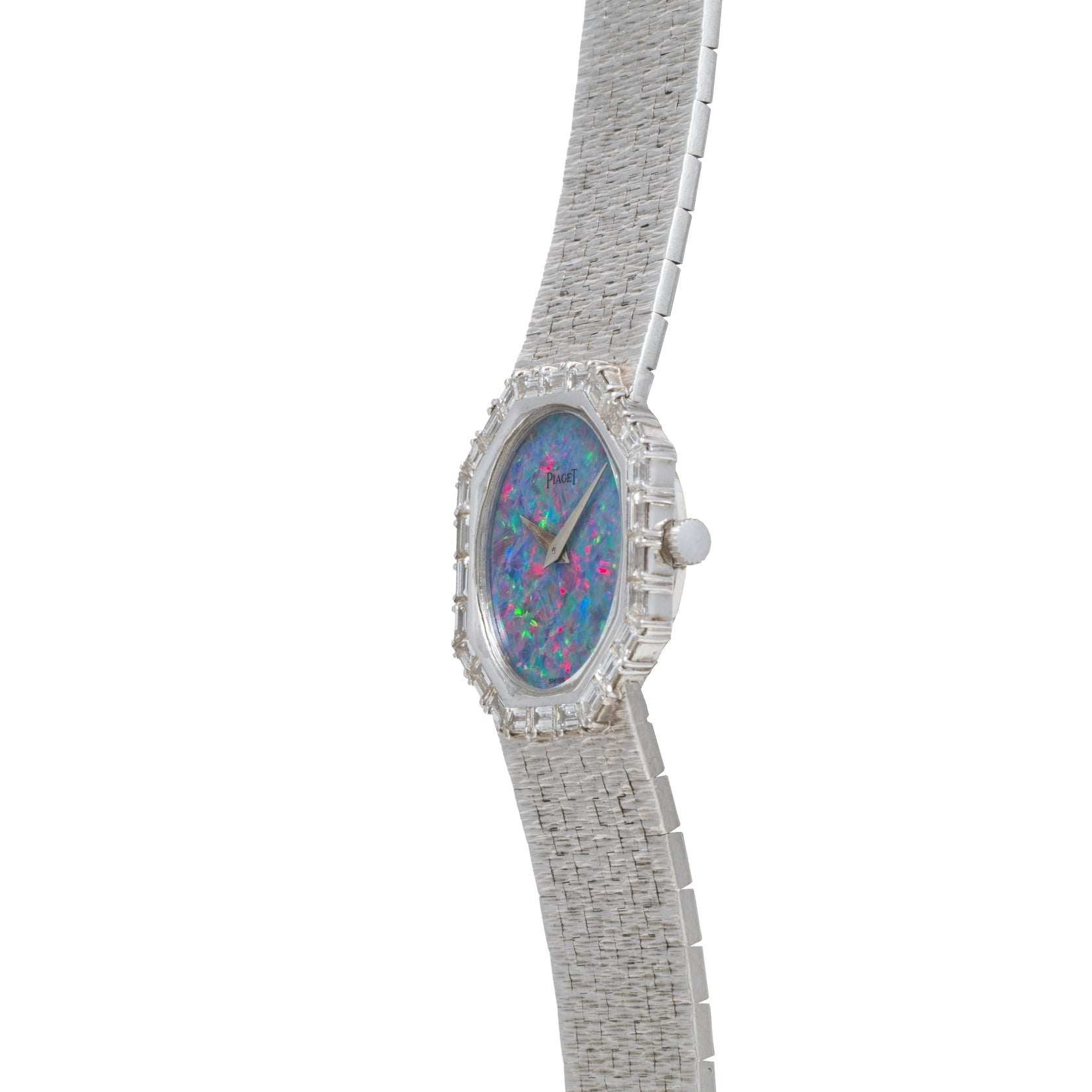 The Piaget Opal White Gold Dress Watch features a textured silver band and a vibrant opalescent face, displayed at an angle.