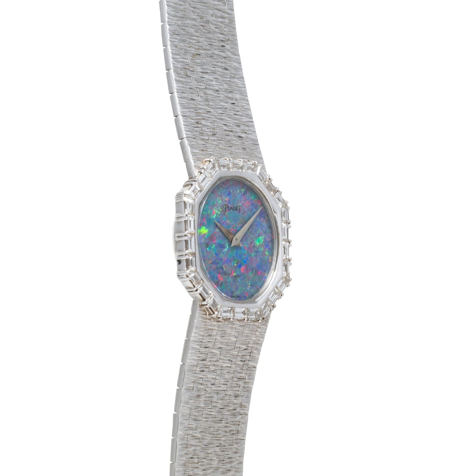 The Piaget Opal White Gold Dress Watch features a textured band and an iridescent blue-green opal face.