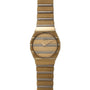 The Piaget Polo Two-Tone features a gold-toned face with horizontal lines and a matching metal link band.