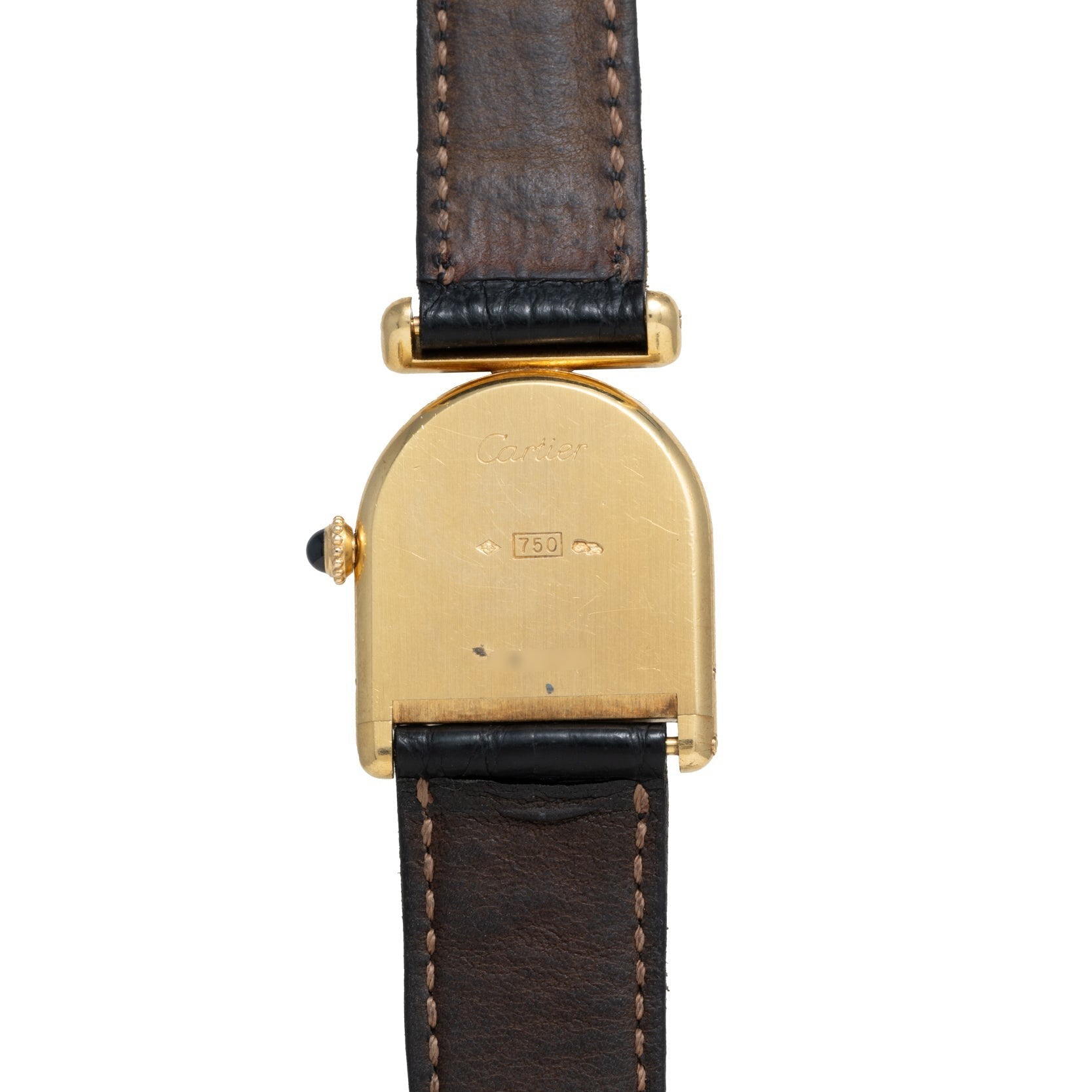 The Cartier Calandre watch features a gold case back, brown leather strap, and engraving, shown from the back.