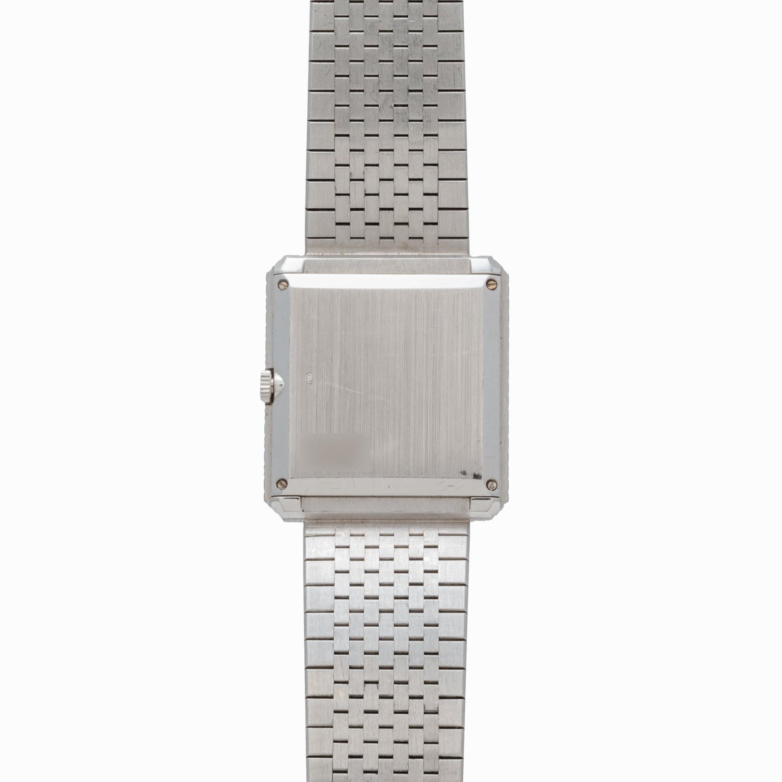 The Piaget Brick Diamond Dress Watch features a silver metal linked bracelet and a square, blank face.
