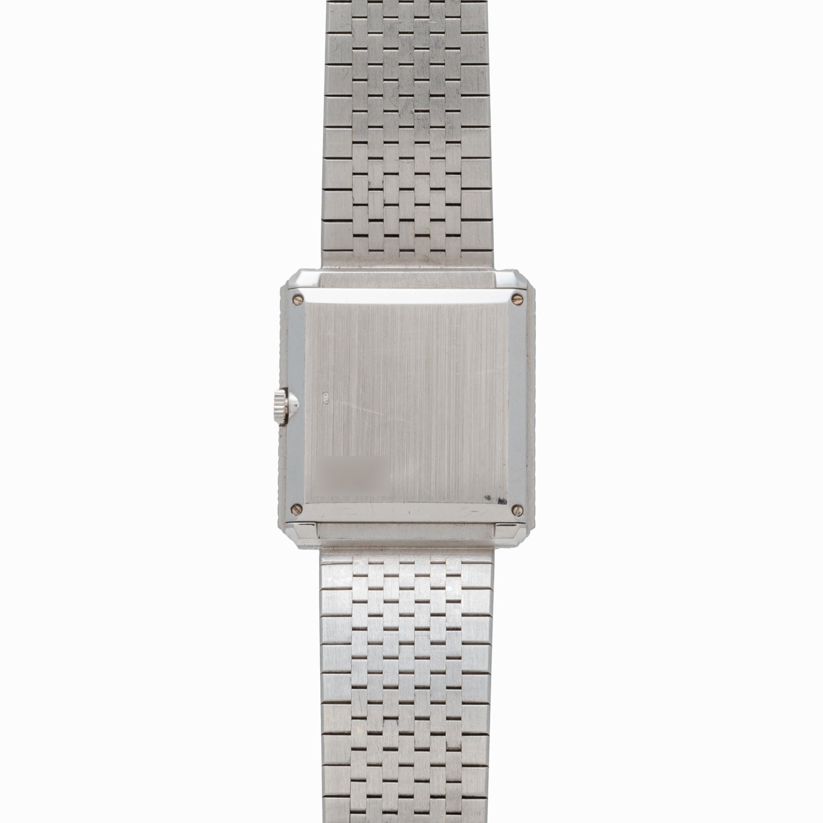 The Piaget Brick Diamond Dress Watch features a silver metal linked bracelet and a square, blank face.