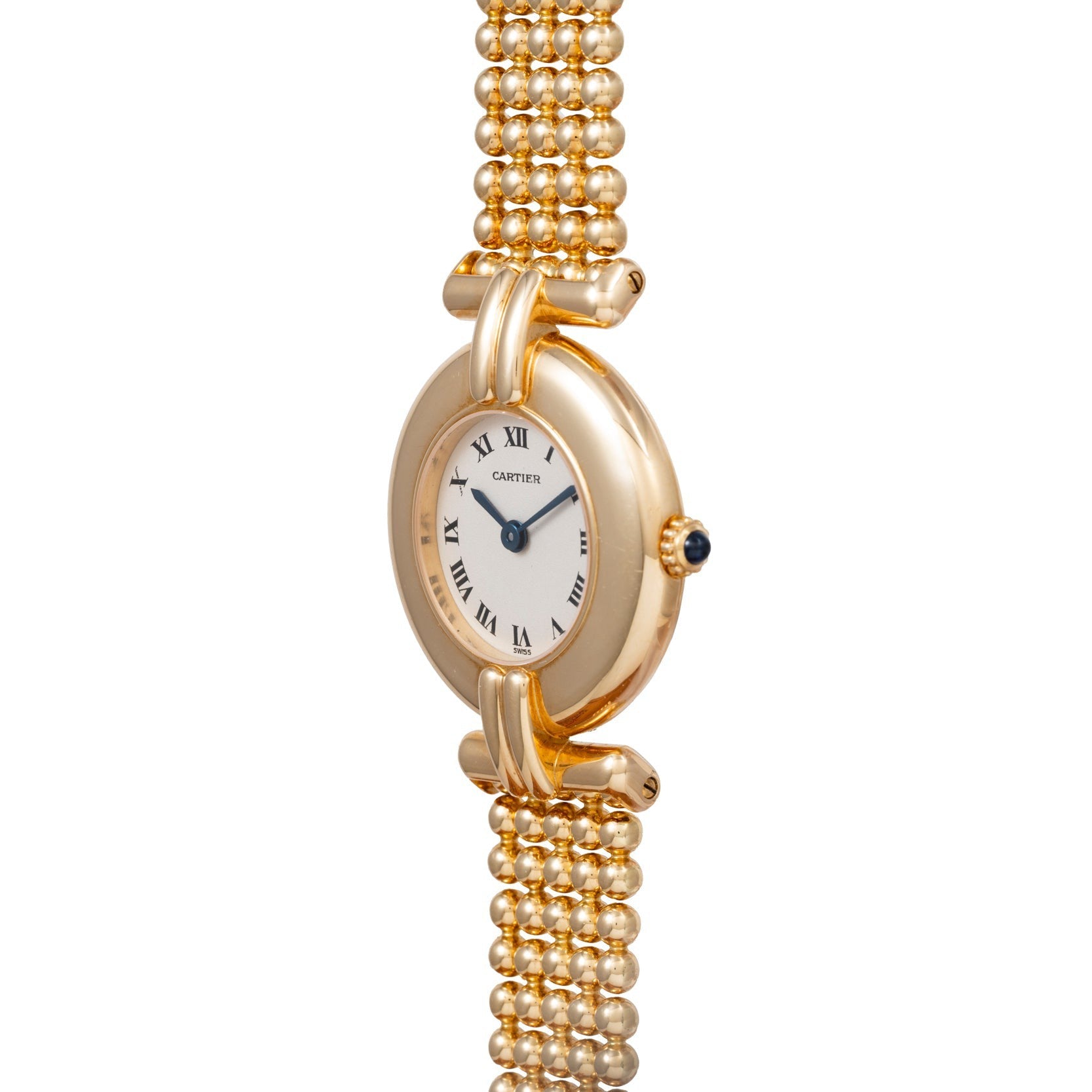 The Ladies Dress Watch by Cartier features a round face, Roman numerals, and a beaded gold bracelet band.