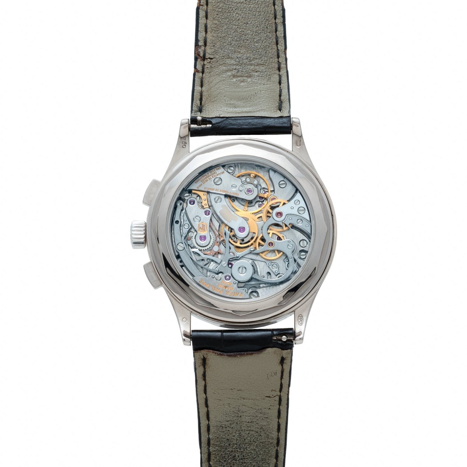 The Patek Philippe Chronograph is a wristwatch featuring an exposed mechanical movement, with visible gears and springs through its transparent case back.