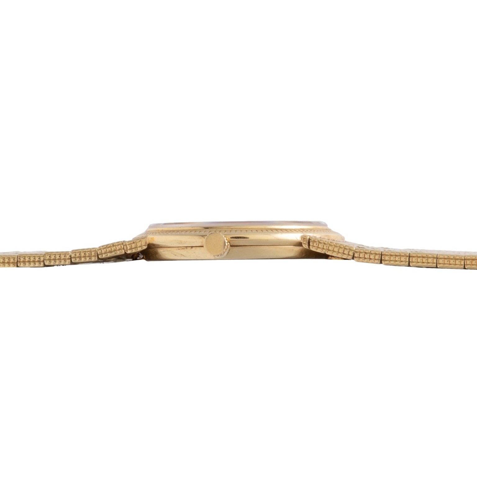 A side view of the Piaget 18K Yellow Gold Dress Watch highlights its slim profile and elegant metal bracelet.