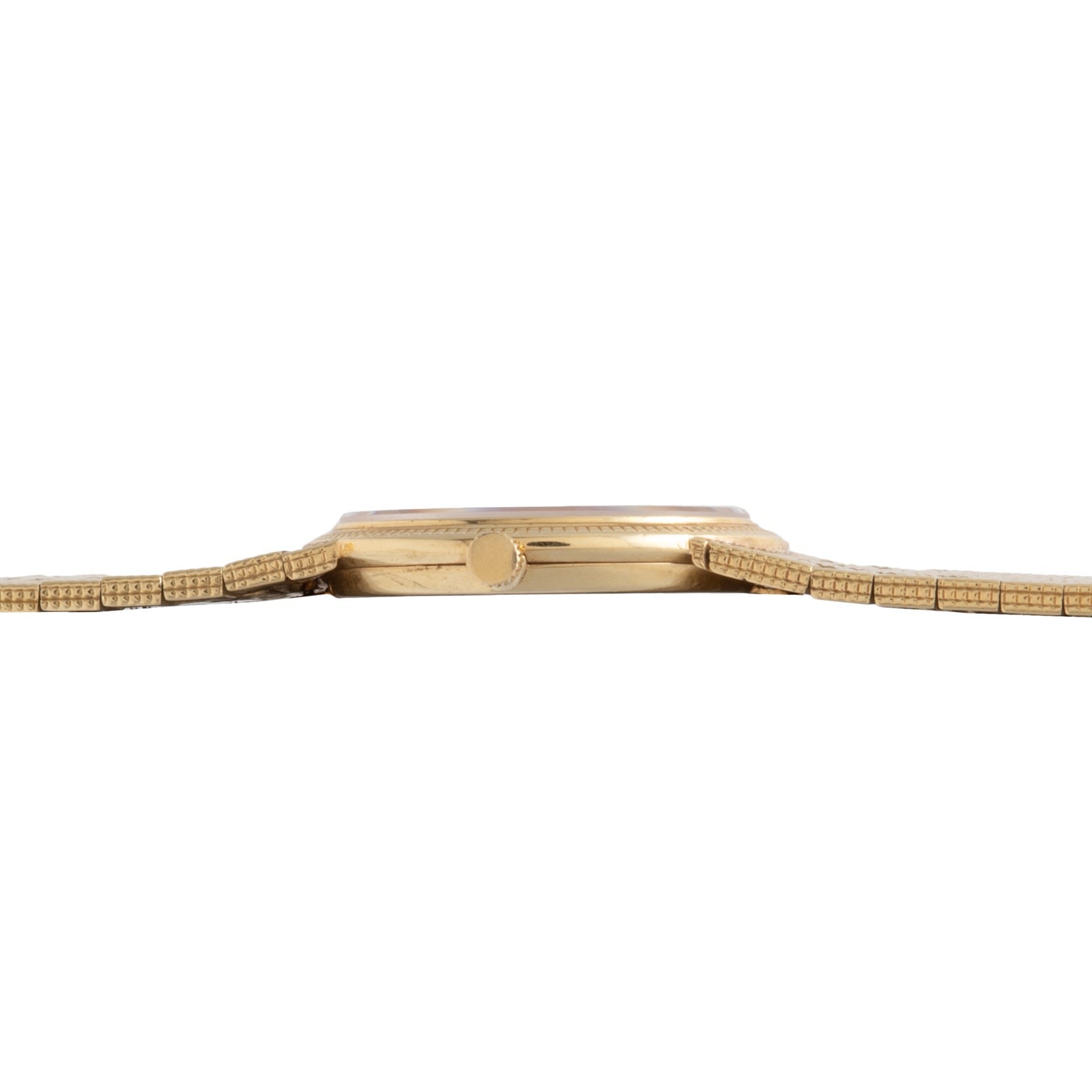 A side view of the Piaget 18K Yellow Gold Dress Watch highlights its slim profile and elegant metal bracelet.