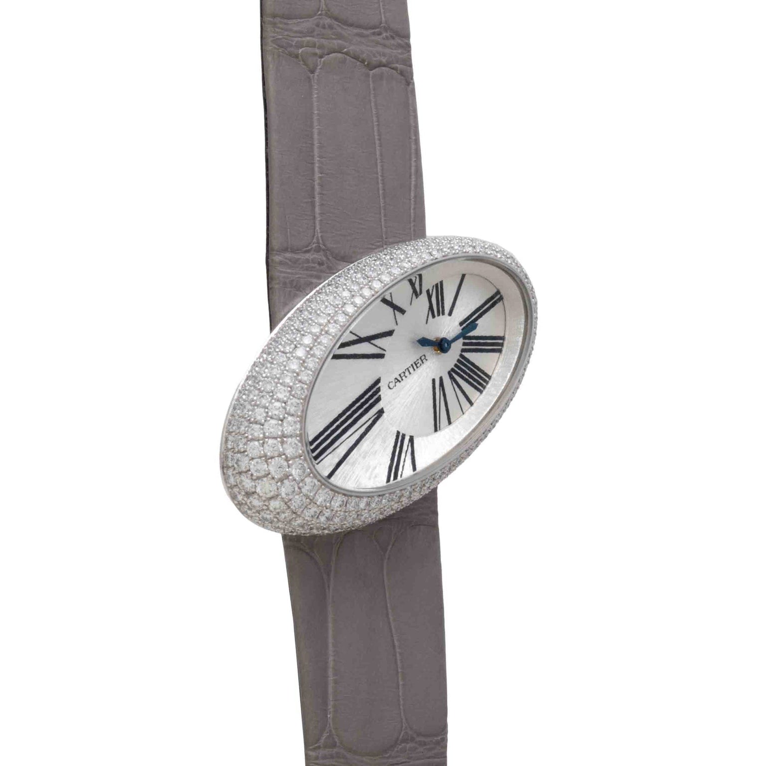 The Cartier Libre Hypnose is an elegant, diamond-encrusted watch with an oval face, black Roman numerals, and a grey leather strap.