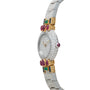 The Cartier Colisee Tutti Frutti Diamond is a luxury watch featuring a diamond-encrusted face, gold accents, green gems, and red oval stones on the band.