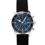 The Breitling SuperOcean B01 Chronograph 44 is a stainless steel watch featuring a blue dial and black textured strap, displayed upright.