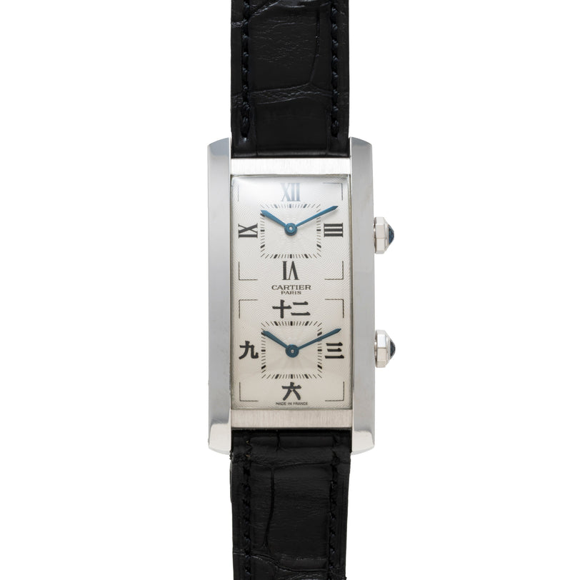 The Cartier Tank Cintrée CPCP Dual-Time features a rectangular case, dual dials, black leather strap, and a white face with Roman and Chinese numerals.