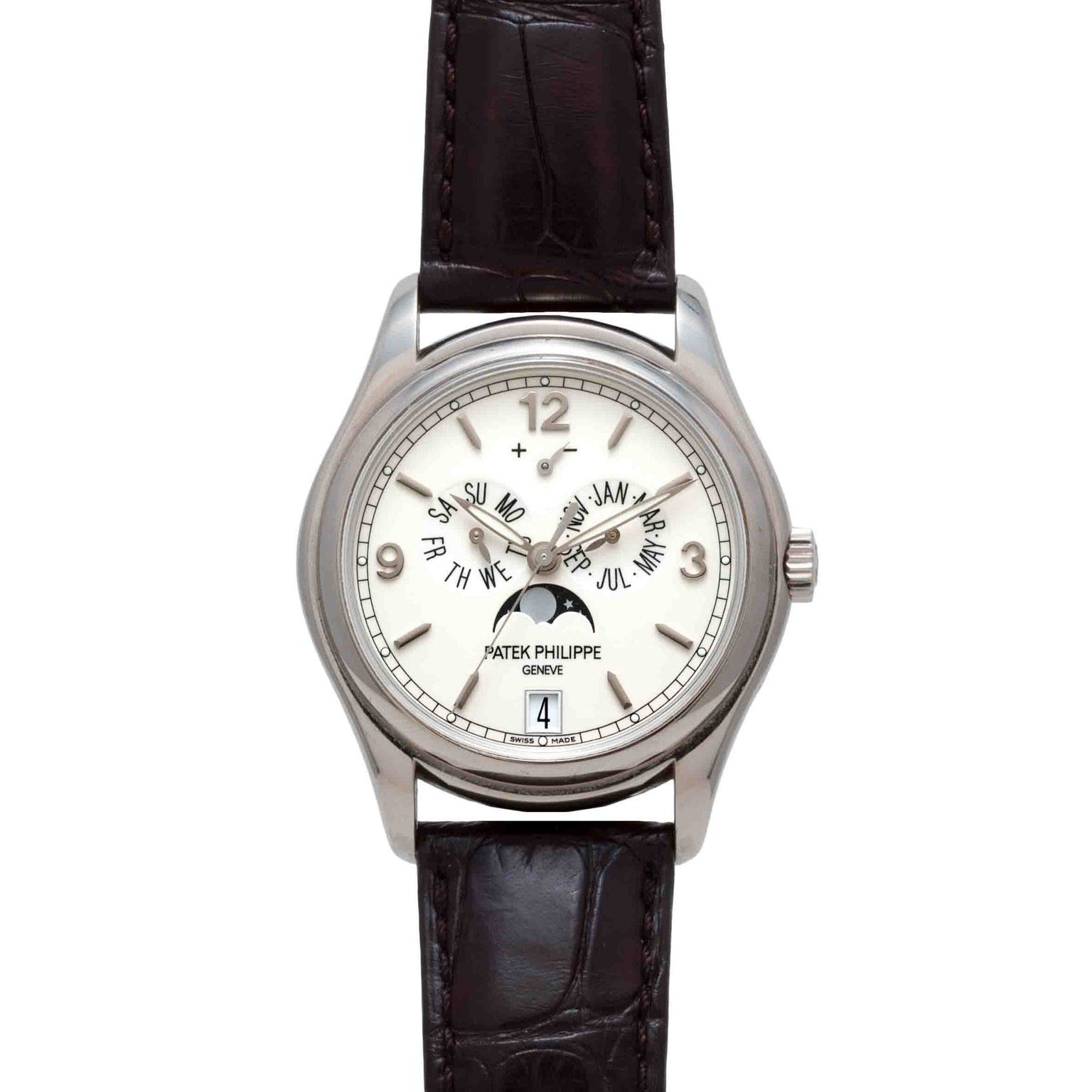 A Patek Philippe Annual Calendar Moonphase watch in silver with a white dial, black leather strap, and displays for date and moon phase.