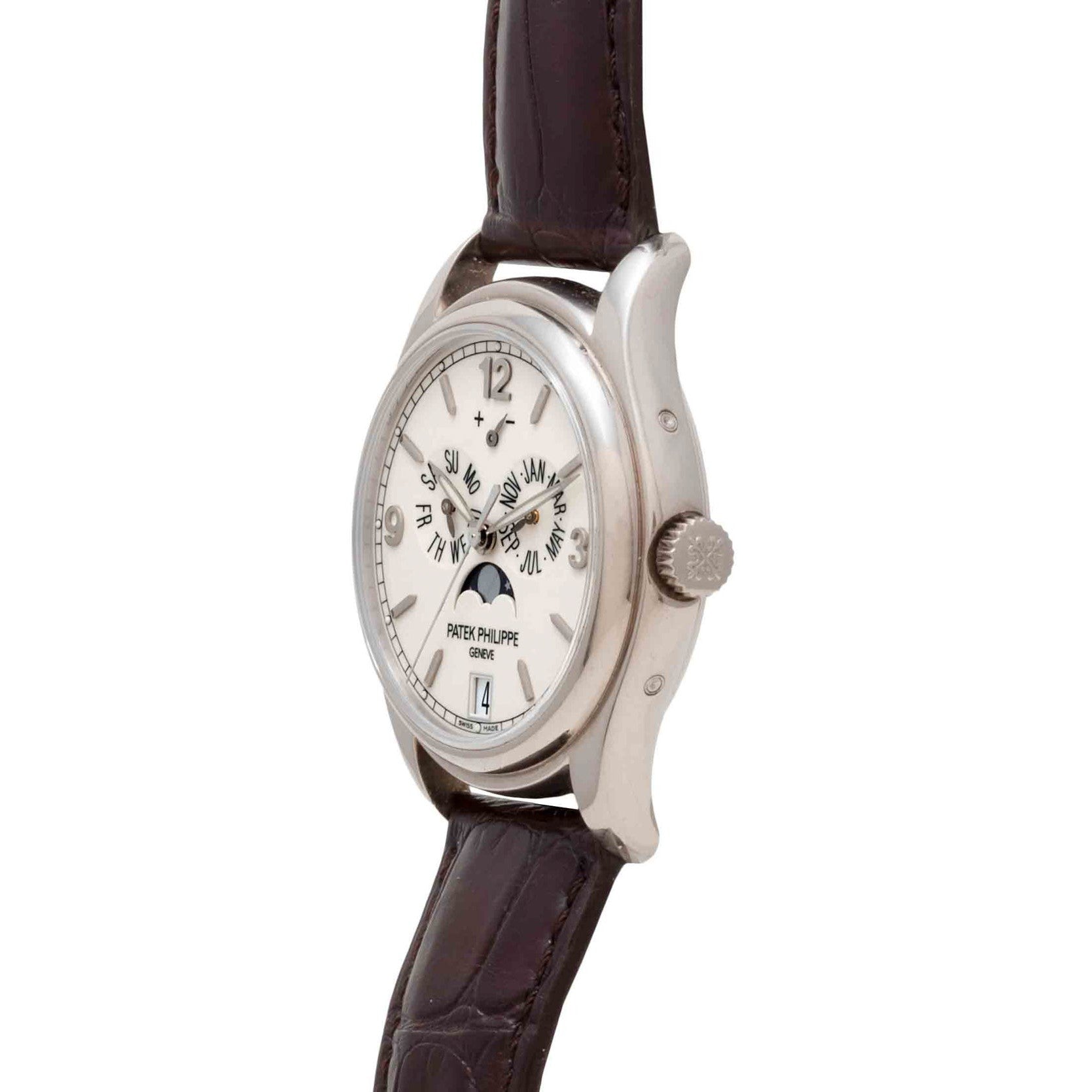 Side view of a silver Patek Philippe Annual Calendar Moonphase wristwatch featuring a leather strap and an intricate calendar dial.