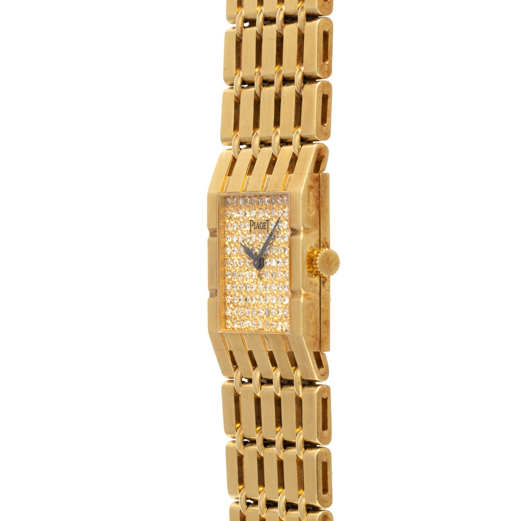 The Piaget Dancer gold wristwatch features a rectangular, diamond-studded face and gold link band, elegantly angled against a white background.