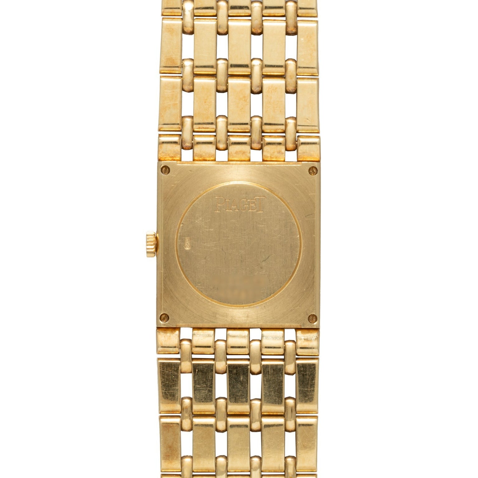 The Piaget Dancer is a gold wristwatch featuring a square case, link bracelet, and “PIAGET” engraved on the back.