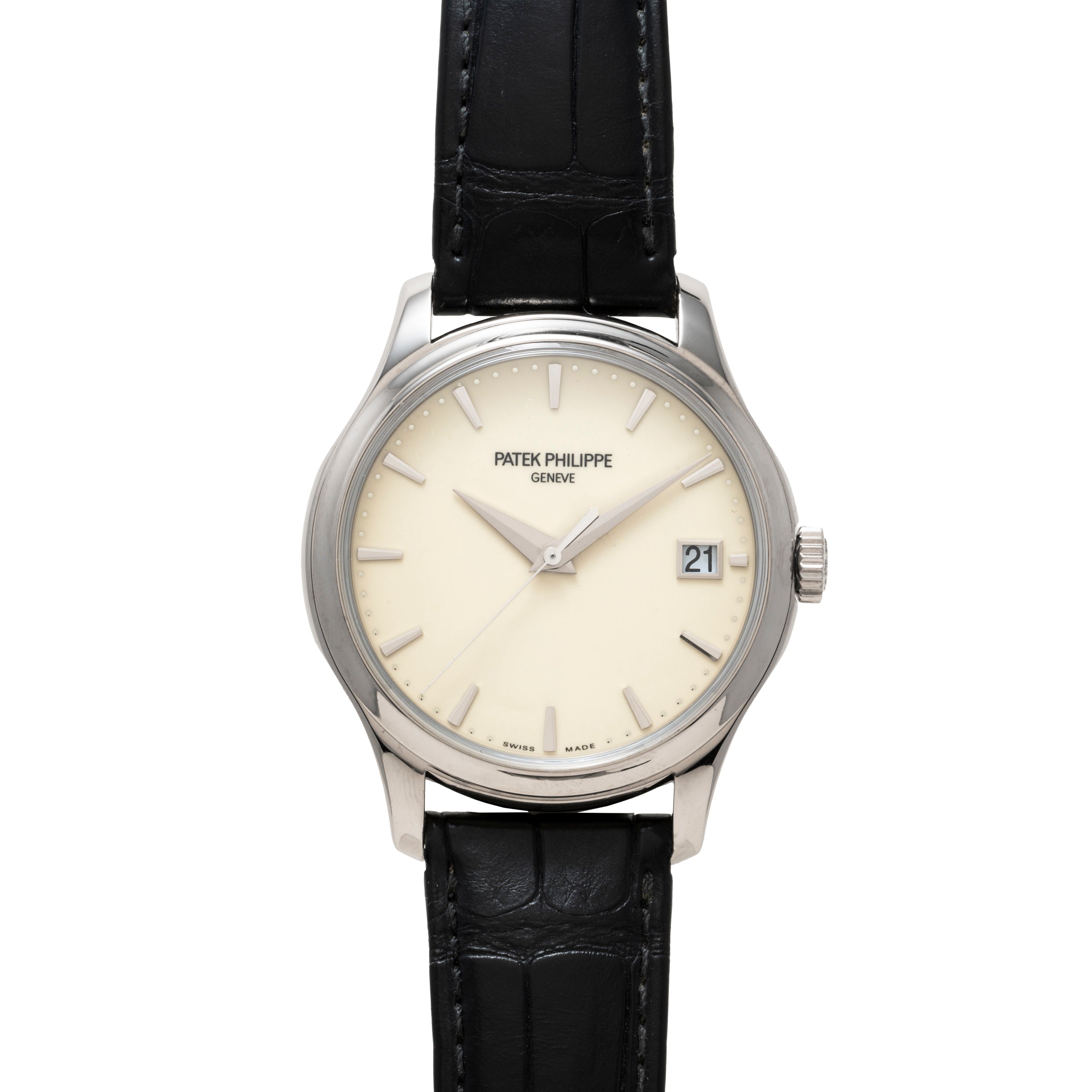 Patek Philippe Calatrava: silver wristwatch with black leather strap, cream dial, and date window at 3 o’clock.