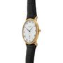 Patek Philippe Calatrava gold wristwatch featuring a white face, Roman numerals, and a black leather strap.