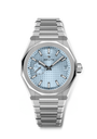 The Zenith Defy Skyline features a silver metal bracelet, a light blue textured dial, and a date display at 3 o’clock.