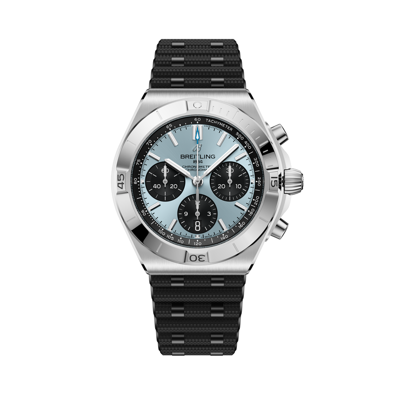 Stainless steel chronograph watch with light blue dial, three black subdials, tachymeter bezel, and black rubber strap.