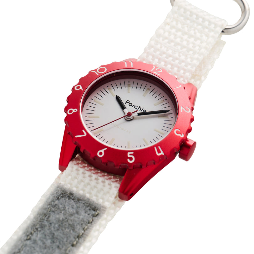 Parchie Lunar-Time Limited Edition for Hodinkee 32 wristwatch by Parchie, featuring a white face and white fabric strap, displayed at an angle on a white background.