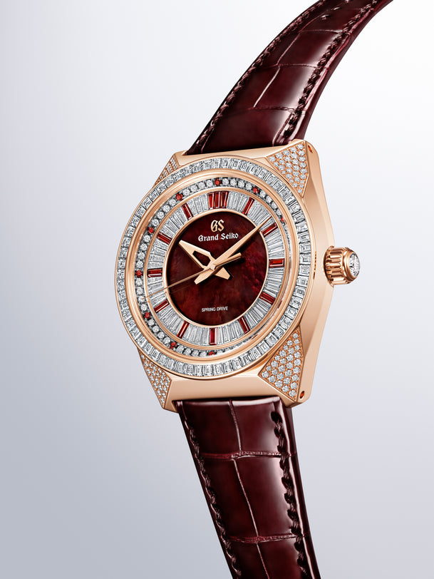 Grand Seiko SBGD228 rose gold watch with burgundy dial, diamond-set bezel, and matching leather strap.