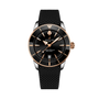 Breitling Superocean Heritage B31 Automatic 42: black and gold wristwatch with a textured black strap and date display at 6 o’clock.
