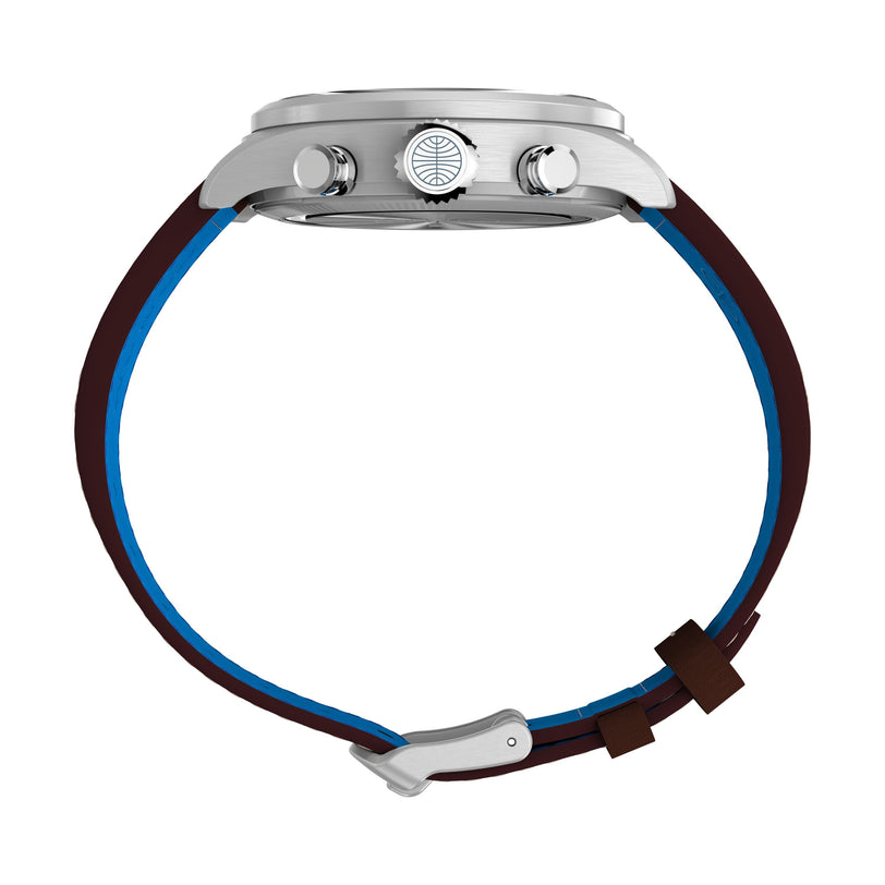 Side view of the Timex x Pan Am® Waterbury Ace Chronograph by Timex, featuring a stainless steel case, two push buttons, patterned crown, and a brown strap with blue inner lining and silver buckle.