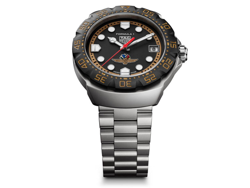 TAG Heuer Formula 1 watch with black dial, white hour markers, red seconds hand, date window, and stainless steel bracelet.