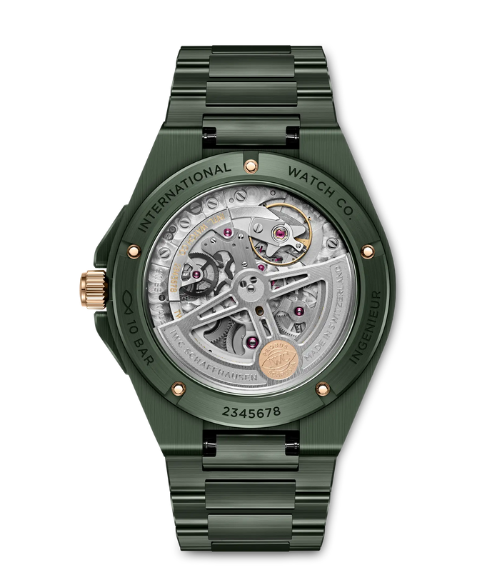 Green steel watch with visible skeleton dial, rose gold accents, and matching bracelet strap.